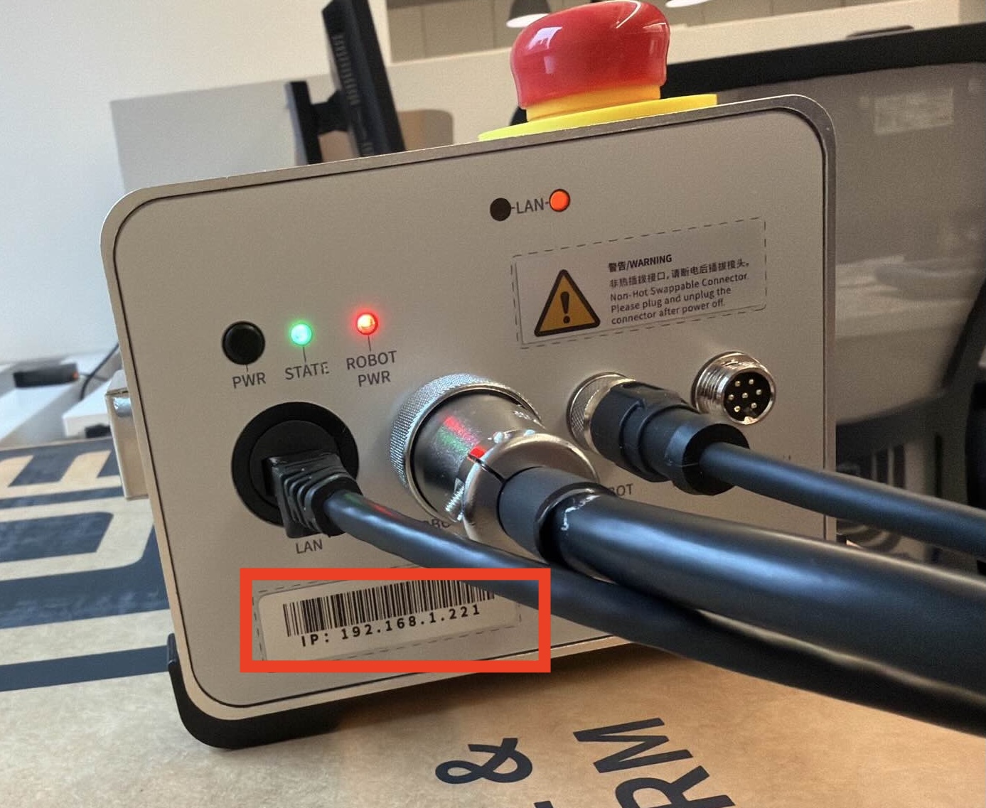 The xArm controller box; the IP address to use for the host attribute is printed on a label.